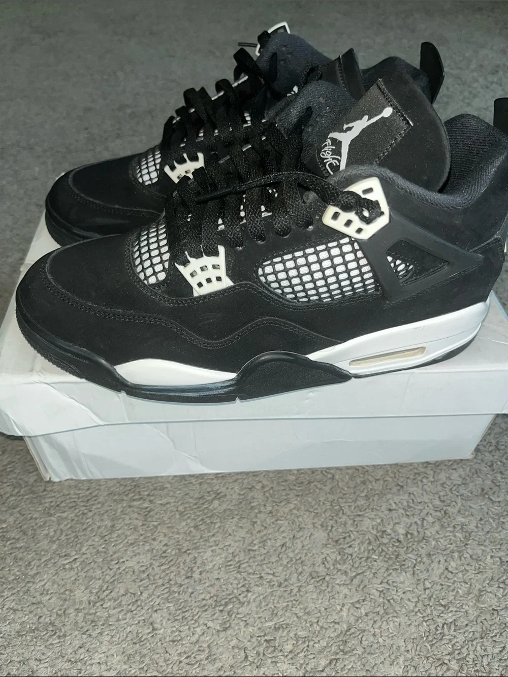 AIR JORDAN 4 RETRO Men’s Black and White Sneaker